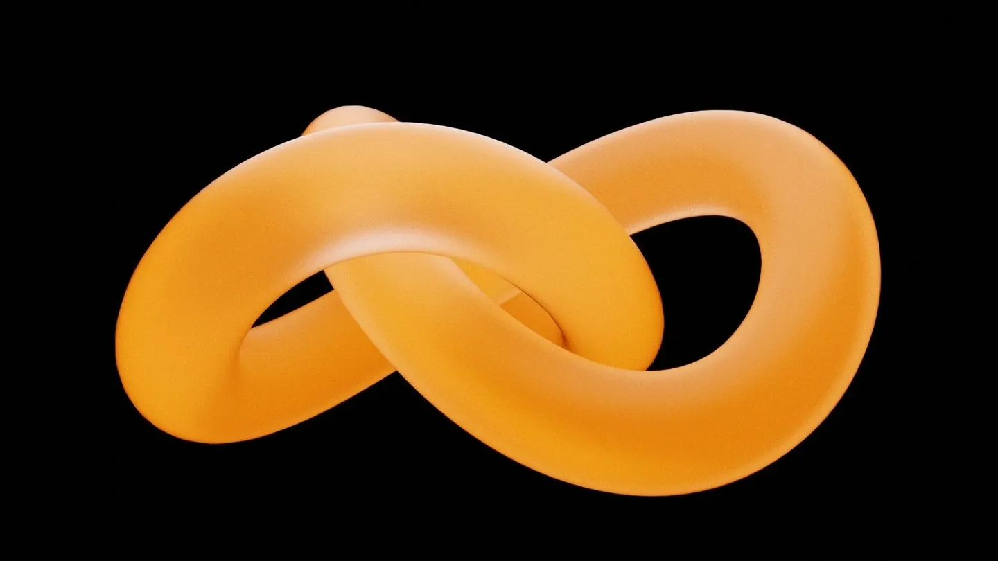 Smooth orange knotted tube on a black background