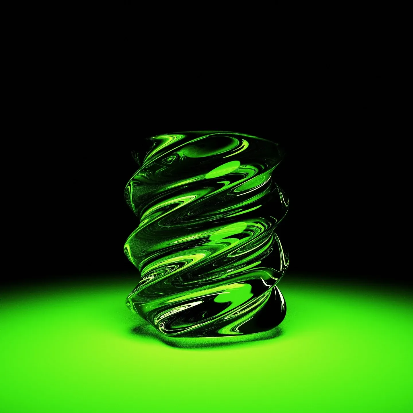 Twisted green glass cylinder standing on a glowing green floor in the dark