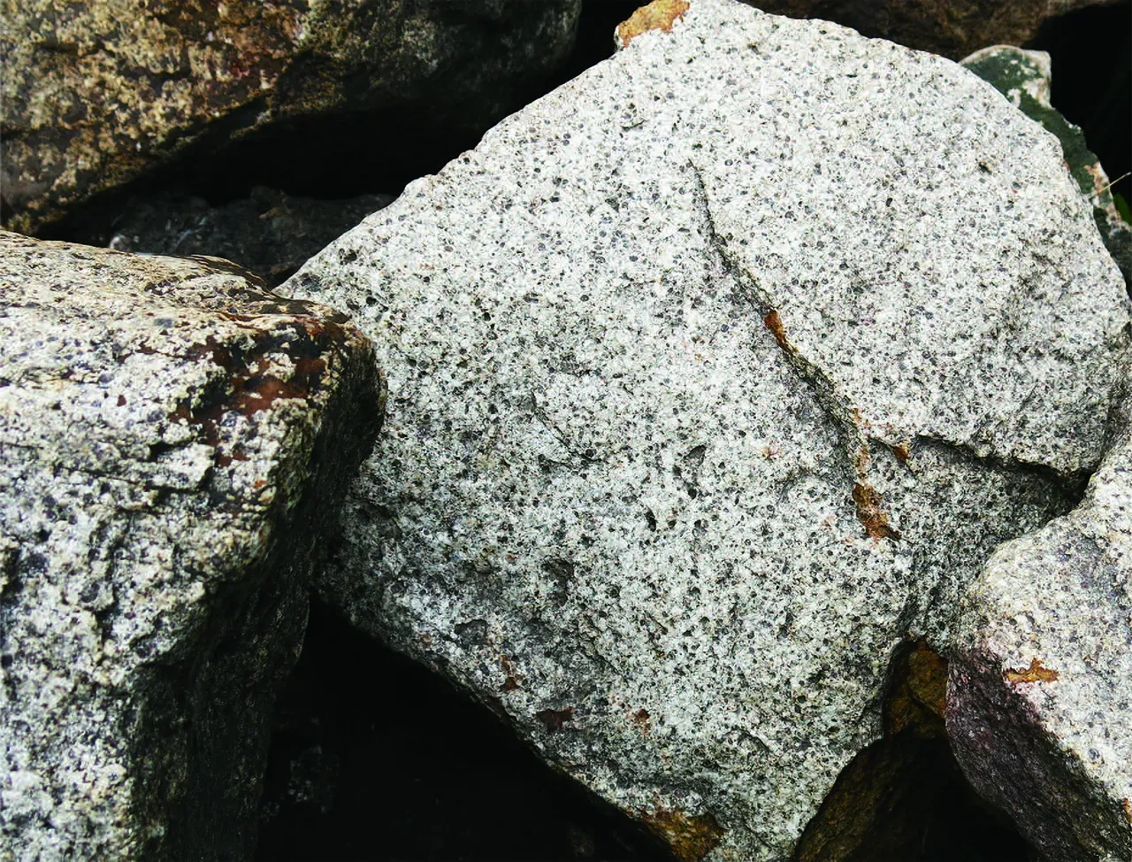 Close-up photo of speckled grey granite rocks